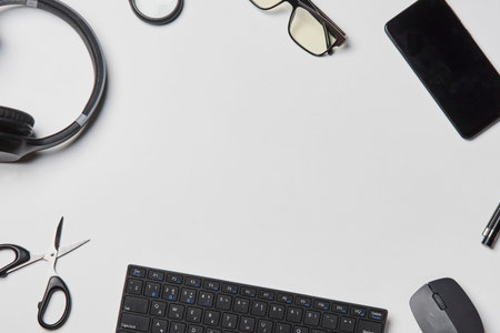 Bright office workspace. Work space with notepad, keyboard, coffee and glasses. Work space table...
