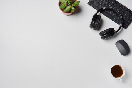 Bright office workspace. Work space with notepad, keyboard, coffee and glasses. Work space table desk. Flat lay, top view, copy spaceの写真素材