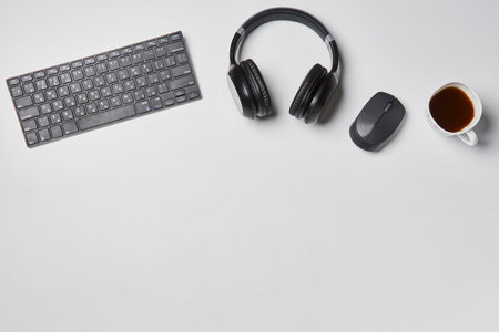 Bright office workspace. Work space with notepad, keyboard, coffee and glasses. Work space table...