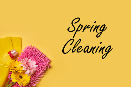 Cleaning service concept. Spring cleaning. Cleaning chemical bottles and supplies. House cleaning concept on colored backgroundの写真素材