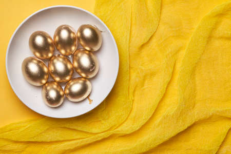 Happy easter time. Bright Easter holiday concept with spring flowers and easter eggs. Colorful Easter eggs backgroundの写真素材