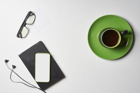 Bright office workspace. Work space with notepad, keyboard, coffee and glasses. Work space table...