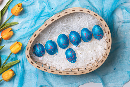 Happy easter time. Bright Easter holiday concept with spring flowers and easter eggs. Colorful Easter eggs backgroundの写真素材