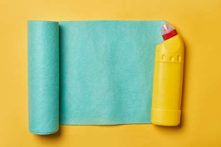Cleaning service concept. Spring cleaning. Cleaning chemical bottles and supplies. House cleaning concept on colored backgroundの写真素材