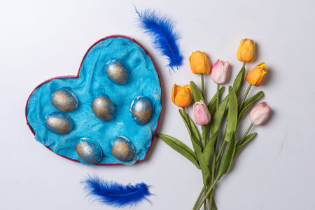 Happy easter time. Bright Easter holiday concept with spring flowers and easter eggs. Colorful...