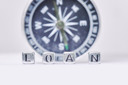 Loan word made of cubes against compass. Loan business conceptの写真素材