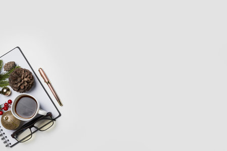 White Christmas, desk office with decoration and work supplies with cup of coffee. Top view with copy space for input the text. Flat lay desk table winter Christmas. Business Holidays Concept.の写真素材