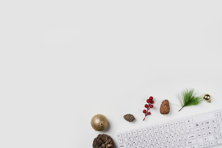 Minimalism. Flat lay Office desk table with computer keyboard and Christmas decoration and cup...