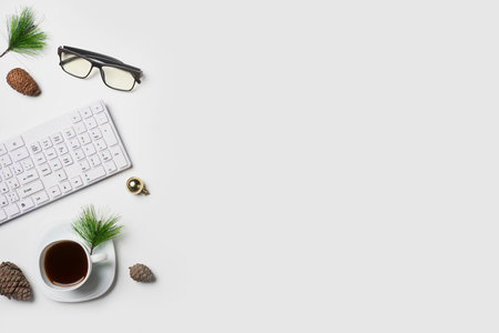 Flat lay Office desk table with computer keyboard and Christmas decoration toys and ornaments on...