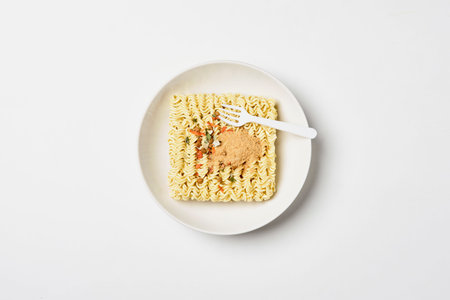 Instant noodles composition. Noodles on white backgroundの写真素材