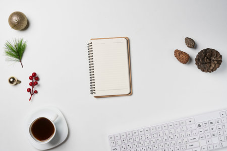 White Christmas, desk office with laptop, decoration and work supplies with cup of coffee. Top view with copy space for input the text. Flat lay desk table winter Christmas. Business Holidays Concept.の写真素材