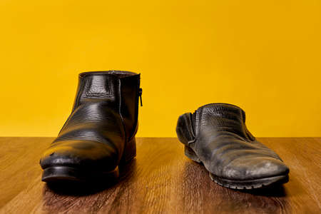 Concept of rich and poor in a shoes, old and new shoeの写真素材