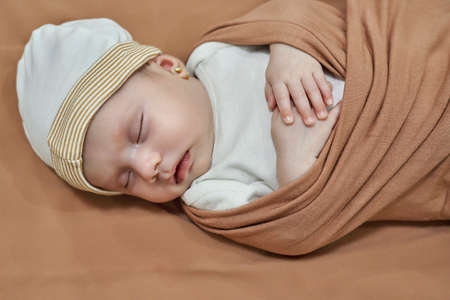 Newborn baby girl, sleeping on a blanket.の写真素材