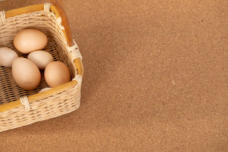 Happy Easter. On the table is a basket, in a basket are eggs of different sizes.