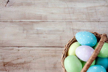 Easter background with Easter eggs in basket. Easter. Painted Easter eggs. Top view with copy space....
