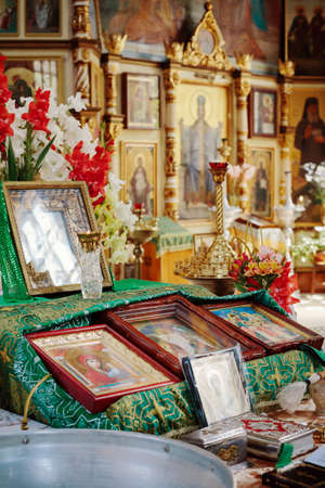 Accessories for Christening. Interior Of Orthodox Church In Easter. baby christening. Ceremony a in Christian . bathing the into the baptismal fontのeditorial素材