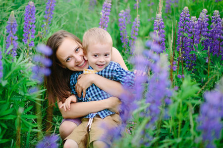 Portrait of a happy mother and son smiling outdoorsの写真素材