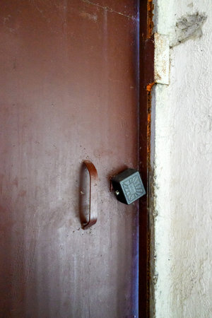 Old lock on the door in the house, closeup of photo