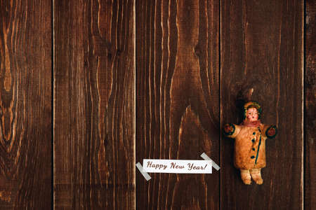 Christmas card on a dark wooden background with retro toyの写真素材