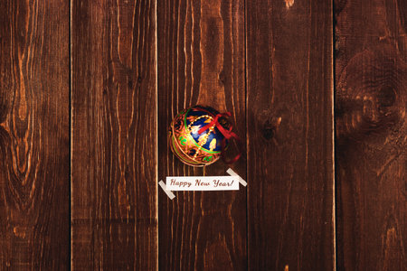 Christmas card on a dark wooden background with retro toy