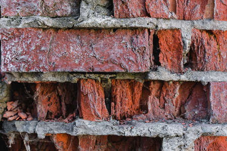 close-up of a broken red brick backgroundの写真素材