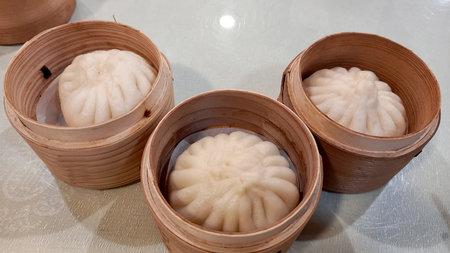 dumplings in wooden pots.の写真素材
