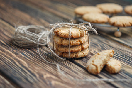 Delicious honey cookies on a brown wooden tableの写真素材