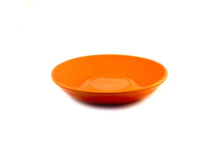 Orange plate from clay on white backgroundの写真素材