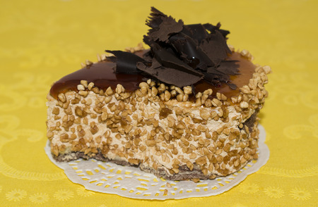Cake with fondant and chocolate on a background of yellow napkinsの写真素材