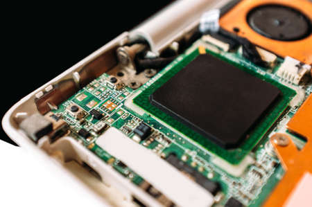 Service of the disassembled laptop. Closeup photo of the processor (cpu) of the netbookの写真素材