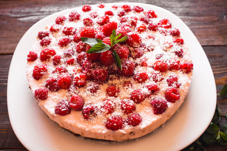 Appetizing vegetarian pie from protein jelly with fresh berries of raspberry. Healthy food. Wooden...