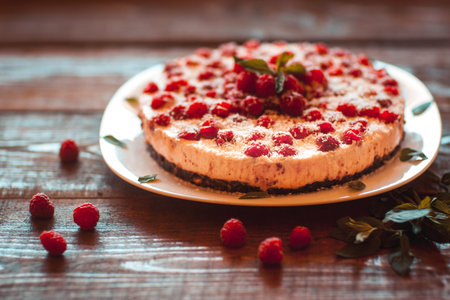 Appetizing vegetarian pie from protein jelly with fresh berries of raspberry. Healthy food. Wooden...