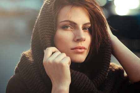 The mysterious thoughtful woman in a hoodの写真素材