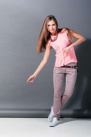 Active girl in motion in the Studio.  Fashion model on photoshootの写真素材