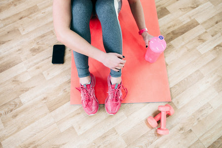 Flat lay sport photography. Female athlete  relax after workout. Fitness flat lay photography of ...