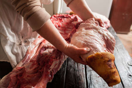 Meat retail of pork leg in farm market. Meat retail in local market.  Top view of pork leg in  butcheryの写真素材