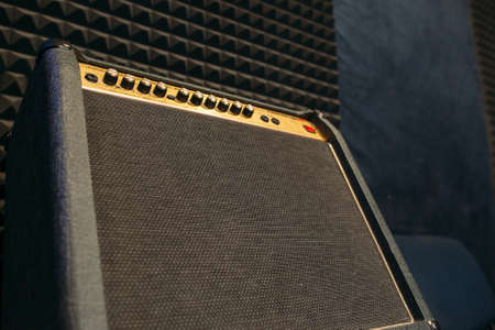 Electric guitar amplifier closep with free spce. Black professional guitar amplifierの写真素材