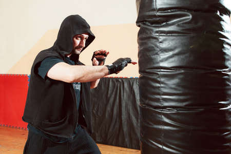 Boxing Man Sport Training Punching bag Fight Lifestyle Gym Self Defence Conceptの写真素材