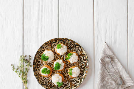 Crackers with cheese cream and parsley, free space, flat lay.の写真素材