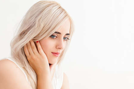 Beautiful blonde with tranquil look on her face.の写真素材