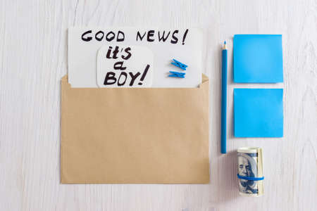 Top view on kit of envelope with note, pencil, money and sticker on white background.の写真素材