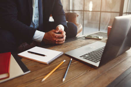 Office employee working at the computer. Summary of the year. Summing up and review concept. Making reports.の写真素材