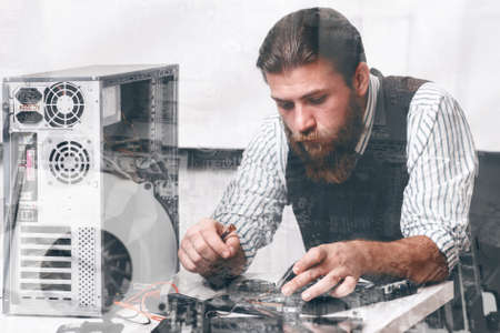 Engineer repairing CPU components, double exposure. Bearded repairman fixing computer circuit at repair shop. Electronic development, construction, renovation conceptの写真素材