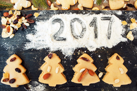 Number 2017 written on flour with cookies. Kitchen art, Christmas spirit, New year symbol