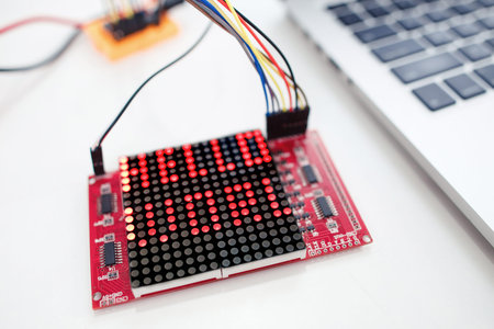 Hello world on led matrix display, close-up. Digital screen with greeting words on it. Electronics,...