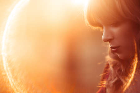 Beautiful woman with closed eyes profile, lens flare, free space. Fashion, art photography, beauty conceptの写真素材