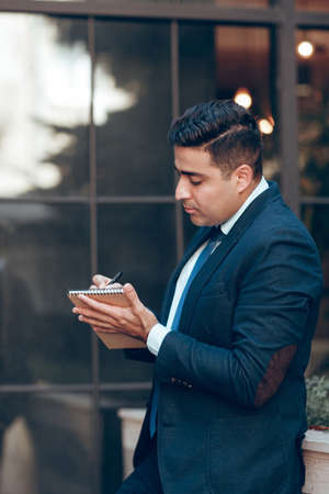 Dynamic businessman having freetime. Work and rest concept. End of working day.の写真素材