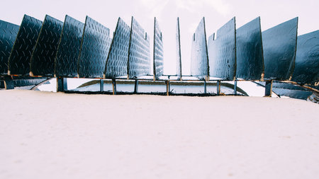 Grate of sewer at sidewalk, copy space. Close-up view on black metal plates of street ventilation grille. Street communications background, free spaceの写真素材
