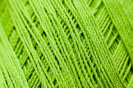 Green knitting thread texture, handiwork backdrop. Bright handiwork background, crochet iris string, Leisure, hobby, needlework conceptの写真素材