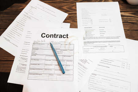Lot of business documents on table, flat lay. Work, deal, contract signing conceptの写真素材
